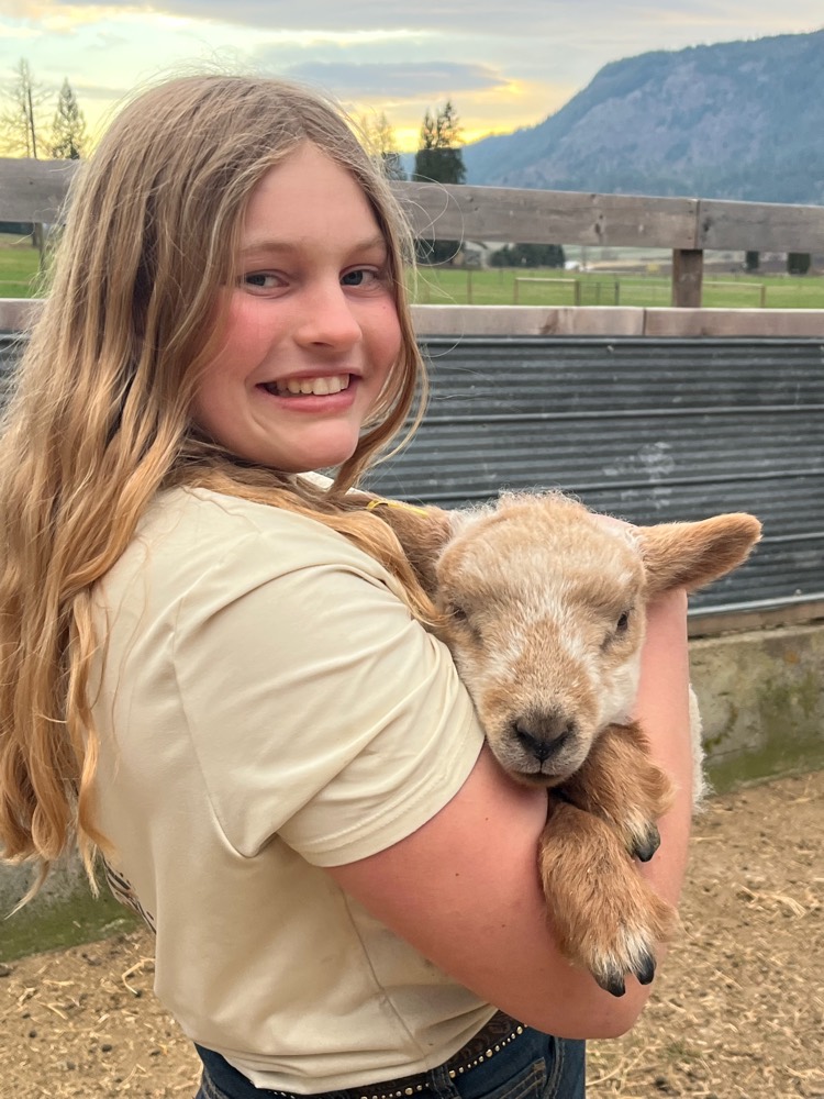 One of the girls holding a spring lamb